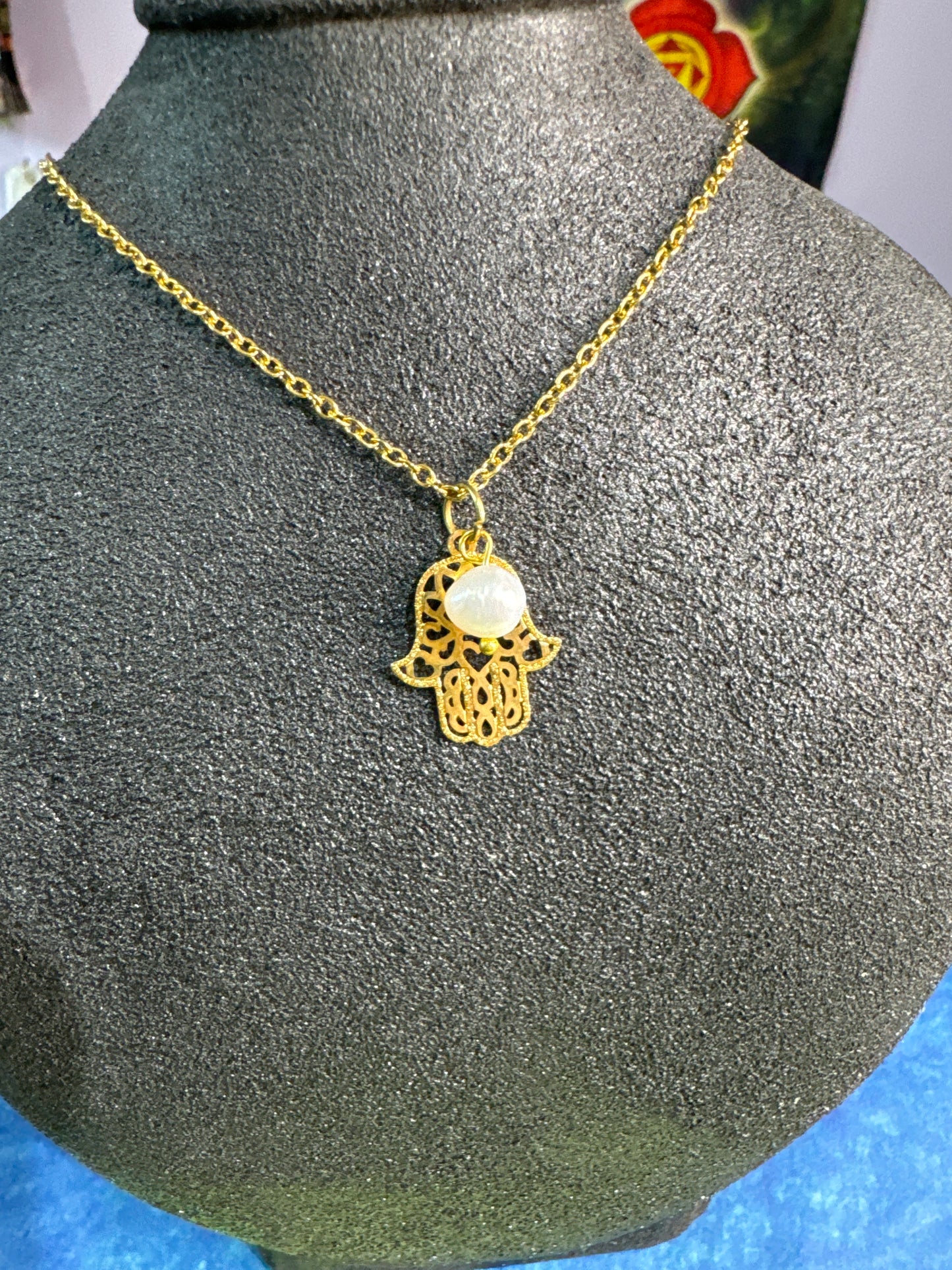 Collar mano con perla